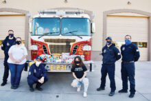 Pictured with the firefighters and medics of Sun Lakes Station 231 are (left to right) Firefighter Ryan Krause, Ms. Chiaramonte, Firefighter Matt Nasr, Basha student and president of the high school's Leo Club Megan Fought, Engineer Evan Mackenzie, and Paramedic Ari Barr. Basha's Leos are affiliated with the SunBird Lions Club. (Photo by Brian Curry)