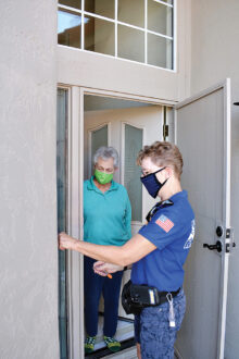 Pictured is Fire Corps member Nancy Roberts completing a lockbox for a Sun Lakes homeowner. AFMA’s Asst. Fire Marshal John Teixeira said, "We are enthused to have our volunteers back.” (Photo by Brian Curry)