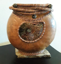 This gourd features an ammonite embellishment and pine needle weaving. It was created by one of our members at a class with Vicki Echols, during the Wuertz Gourd Festival in February of 2019.